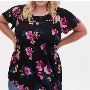 TORRID top, tunic length, crepe fabric, black with florals, flutter sleeves.